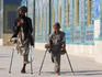 Father and son amputees outside the Shrine of Hazrat Ali.