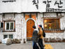 People walking past Chilgapsan exterior, Gwanghwamun.