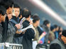 People studying form guide at Seoul Racecourse.