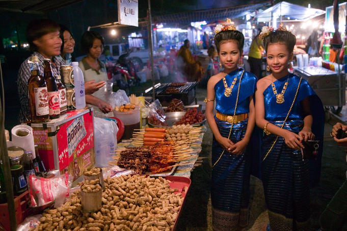 Young dancers at food stalls.