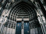 Gothic architecture of the central doorway (portal) at the southern end of Cologne Cathedral (Kolner Dom).