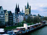 The Altstadt (old town) long the Rhine River with Cologne Cathedral (Kolner Dom), left, and Church of Gross Saint Martin, right, in the background.