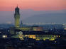 City skyline, with Palazzo Vecchio, illuminated at dusk.