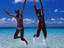 Teenage girls jumping, Australia
