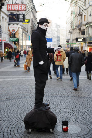 Lonely busker on Karntner Strasse.