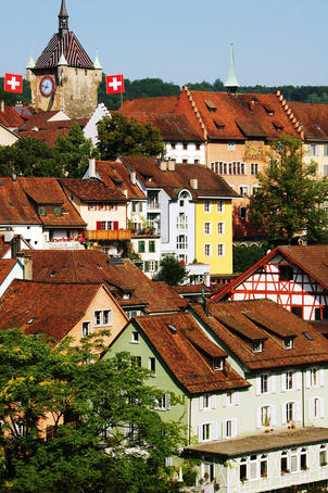 Gothic Stadtturm (tower, also known as Brugger- or Baderturm) above old houses in medieval town centre.