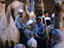 Men at camel market, Nile Valley, near Cairo.