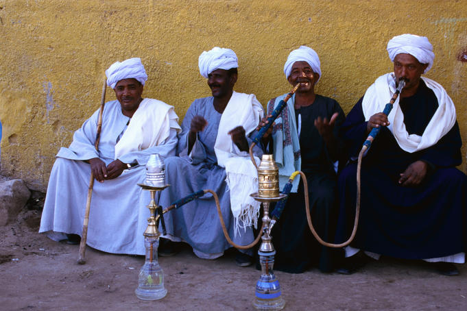Men smoking water pipes.