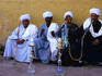 Men smoking water pipes.