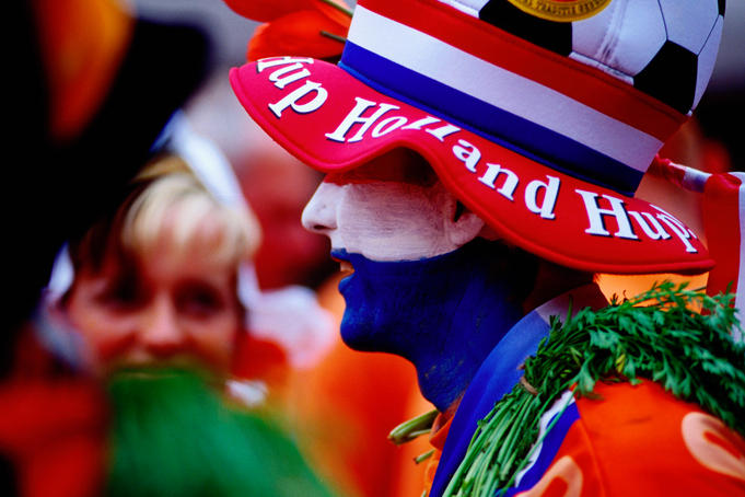 Supporters of Dutch national football team in costume.