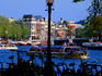 Amstel river sightseeing boats with bicycles in foreground.