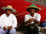 Portrait of men near boat in Sunda Kelapa.
