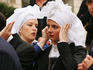 Wedding guests dressed in period costume.