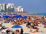 Crowds sunbathing on South Beach on New Year's Eve.