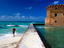 Tourist near moat wall of Fort Jefferson, Garden Key