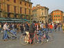 Sunday crowds stroll and be seen in Piazza Bra.