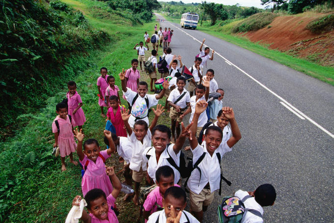 Happy school kids along Kings Road, Naimasimas.