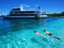 Couple snorkelling near the MV Nanuya princess, Blue Lagoon Cruise, Nanuya Lailai Island.