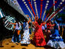 Feria de Abril (April Fair) girls dancing sevillana beneath lanterns.