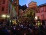 People dining alfresco in front of cathedral at dusk, Costiera Amalfitana.