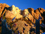 Presidents' heads at Mount Rushmore National Memorial, with state flags in foreground.