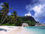 Beach, palm trees and granite rocks.
