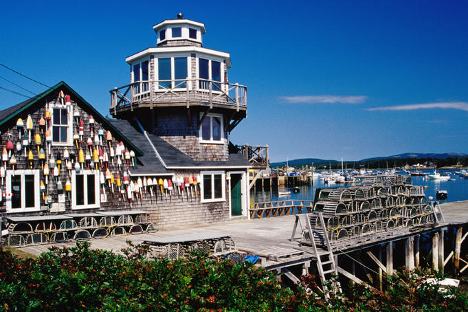 Fishing shed, buoys and lobster traps on harbour, Bernard.