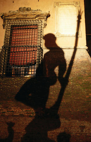 Shadow of Neptune in Piazza del Nettuno from 1566 fountain.