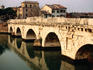 Roman built Tiberius bridge (AD 14-21) spans Marecchia River.