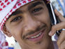 Omani teenager with mobile phone.
