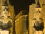 Ruins floodlit at night.