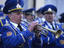 Military brass band in blue uniforms.