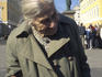 Elderly lady with tray of painted Ukrainian Easter eggs.