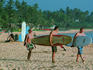 Surfers on main beach, heading out.