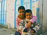 Portrait of young girl and boy on their way to school.
