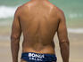 A 'Bondi' Surf Life Saver at Surf Life Savings competitions, Bondi Beach.