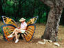Woman sitting in butterfly chair at Botanical Gardens, Zilker Park.