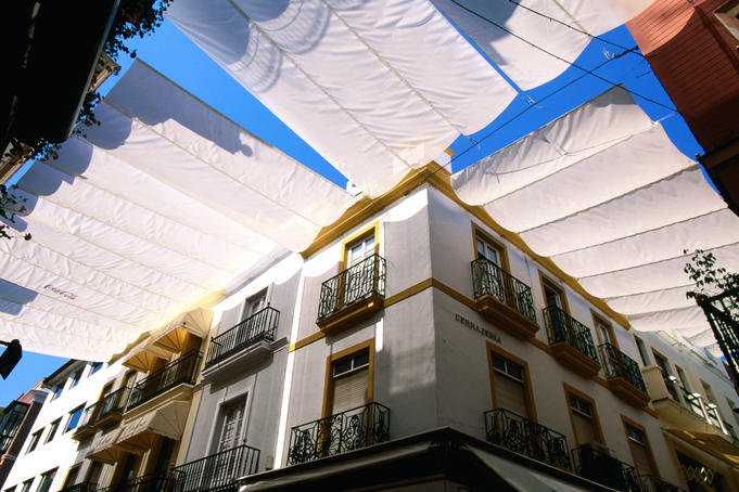 Awnings over Calle Sierpes street.