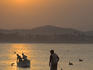 Silhouette of fisherman and boats.