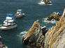 Cliff divers and boats, La Quebrada Cliffs.