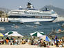Acapulco beach with cruise ship in port.