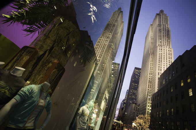 GE Building in Rockefeller Center, reflected in corner window of LaCoste store on 49th and 5th Avenue.