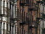 Fire escapes decorate facades of Lower West Side apartment buildings.