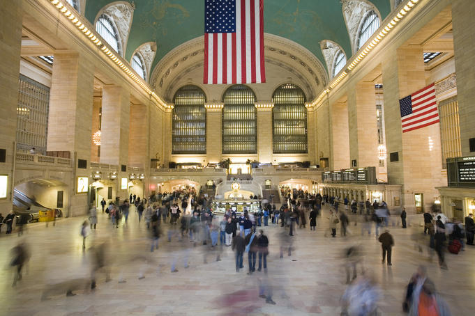 People in motion inside Grand Central Station.