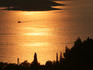 Yacht seen from Venetian Fortress (1551),overlooking Hvar Town. making its way to Hvar Island at sunset.