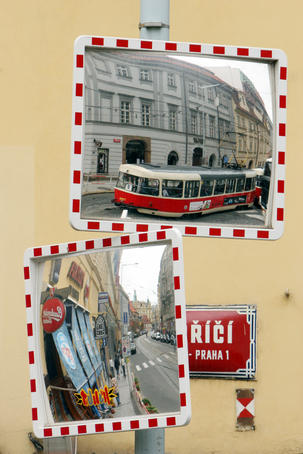 Tram reflected in a mirror at intersection on Na porici (street), Nove Mesto.