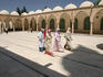 Group of young Turkish women walking through colonnaded courtyard of Hazreti Ibrahim Halilullah.