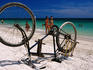 Upturned bike on beach.