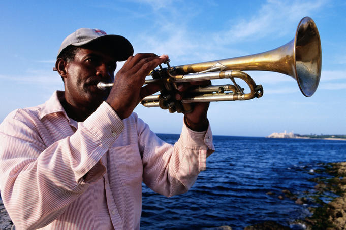 Cuban man playing trumpet, Malecon.