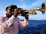 Cuban man playing trumpet, Malecon.